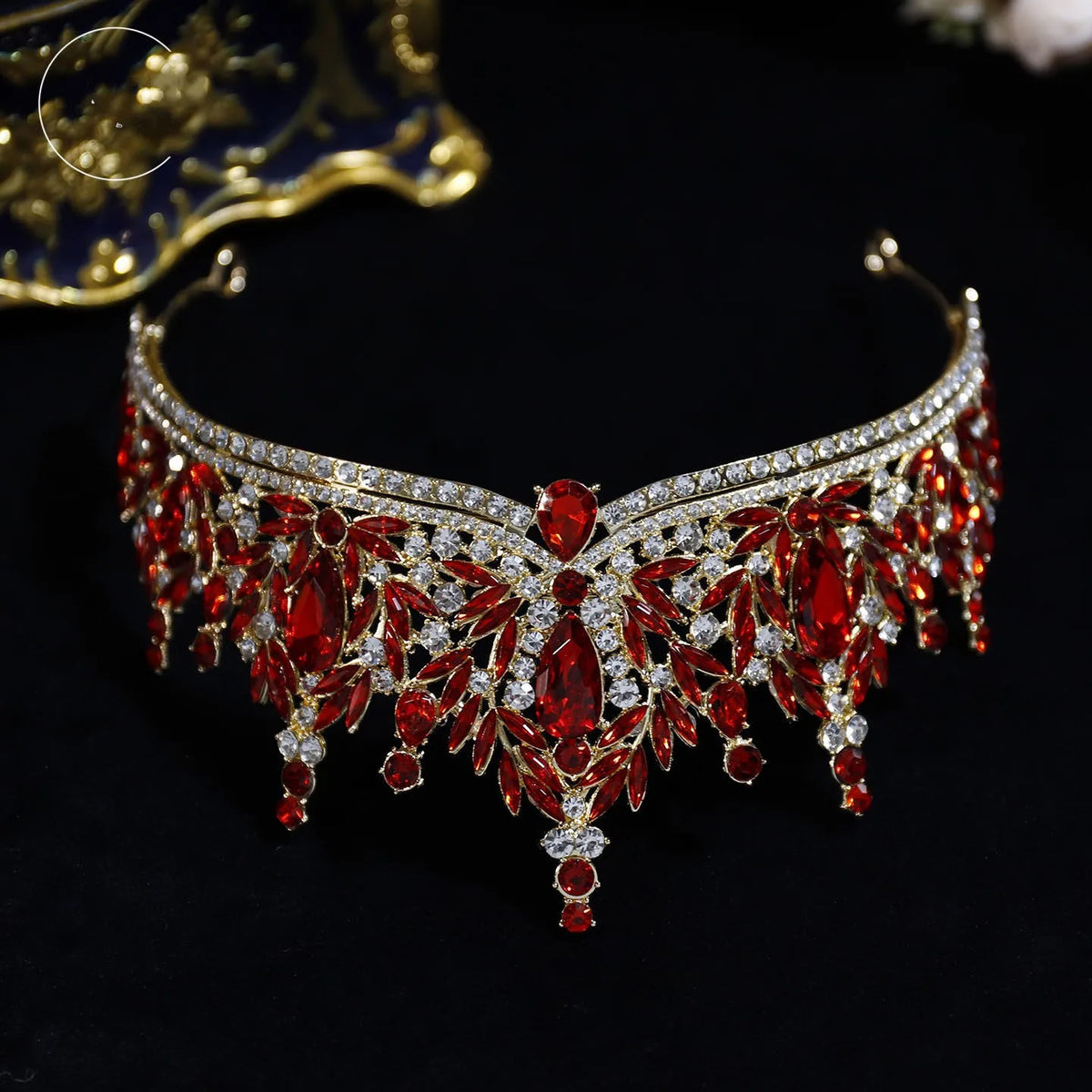 Red crystal tiara with silver filigree fringe and central teardrop drop stones