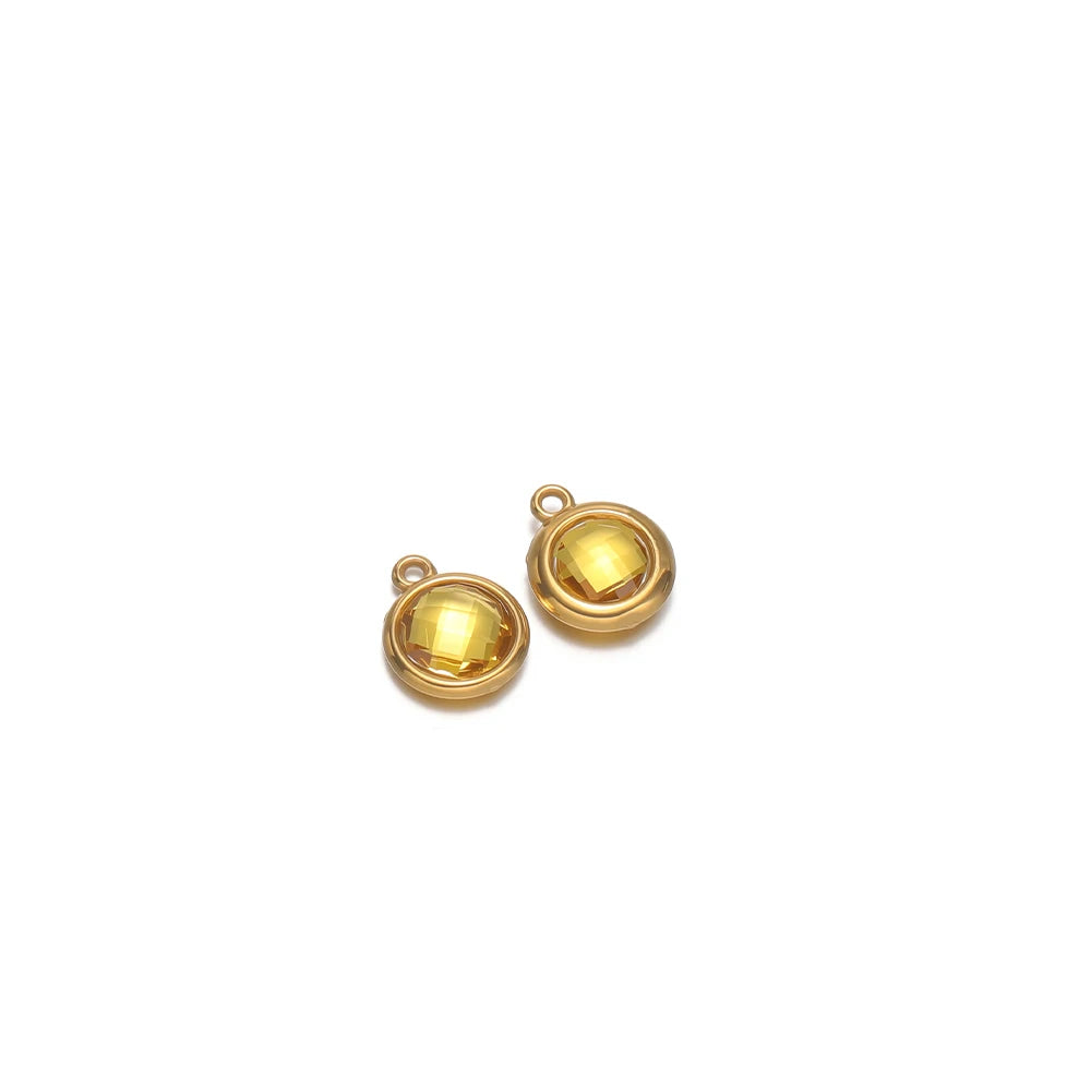 Round golden faceted glass charm pendants with gold-tone frames and loop hooks