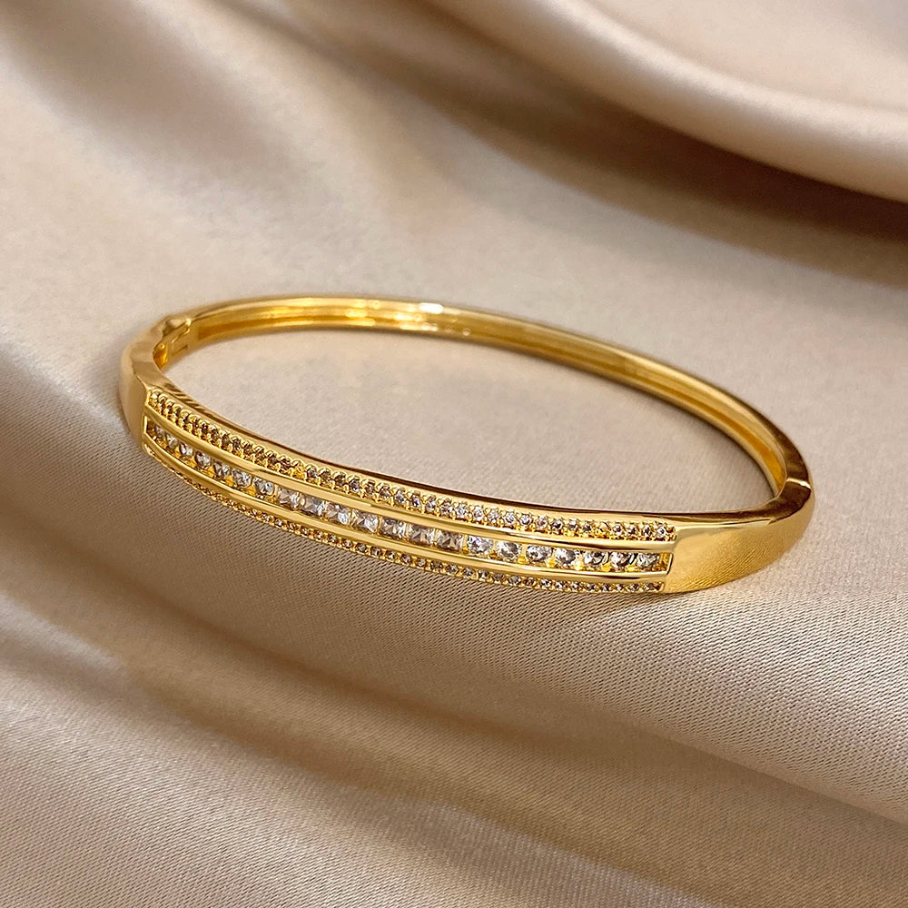 Gold-plated wide cuff bangle with sparkling micro zircon inlaid row across the band