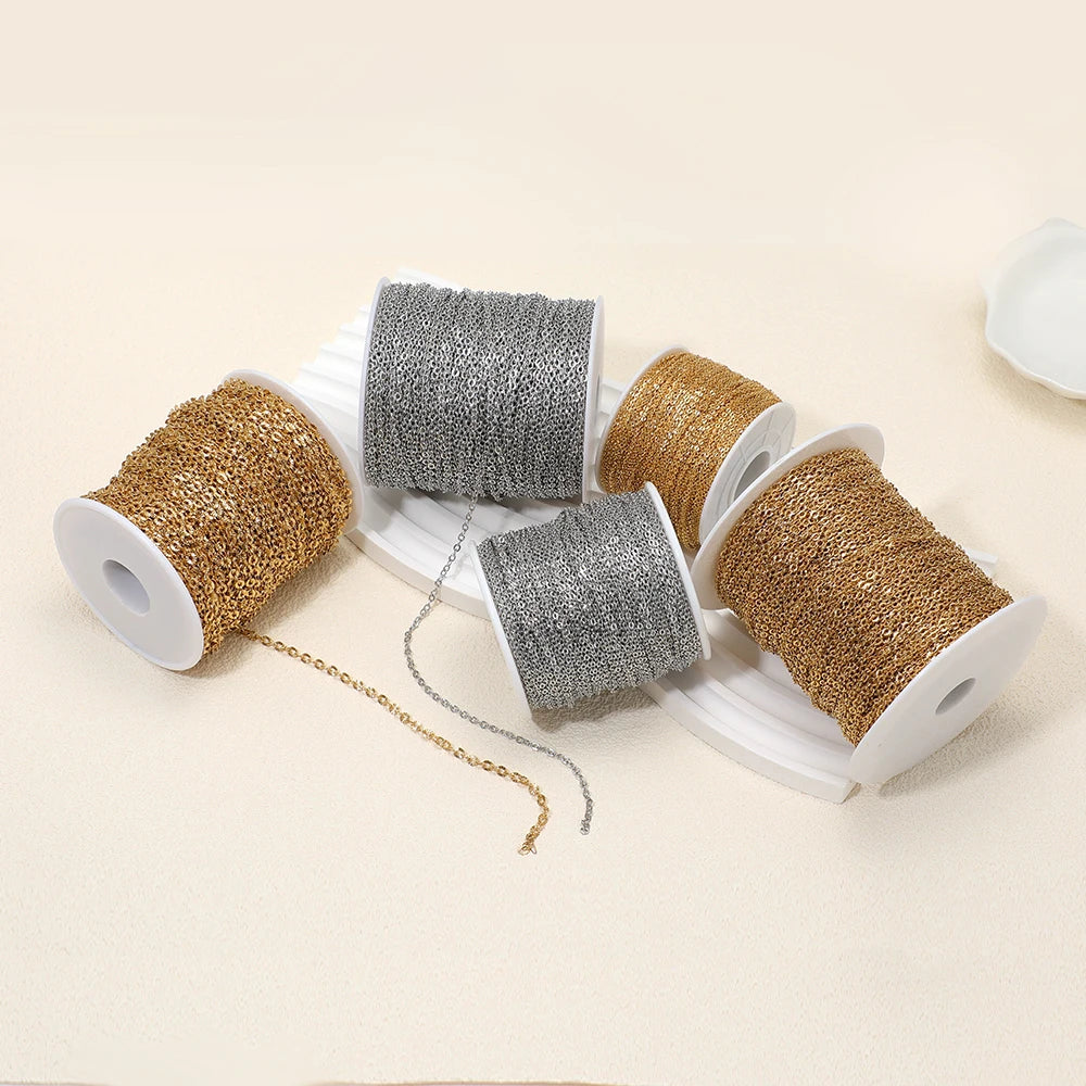 Textured chain mesh jewelry cord on spools, gold and silver tones