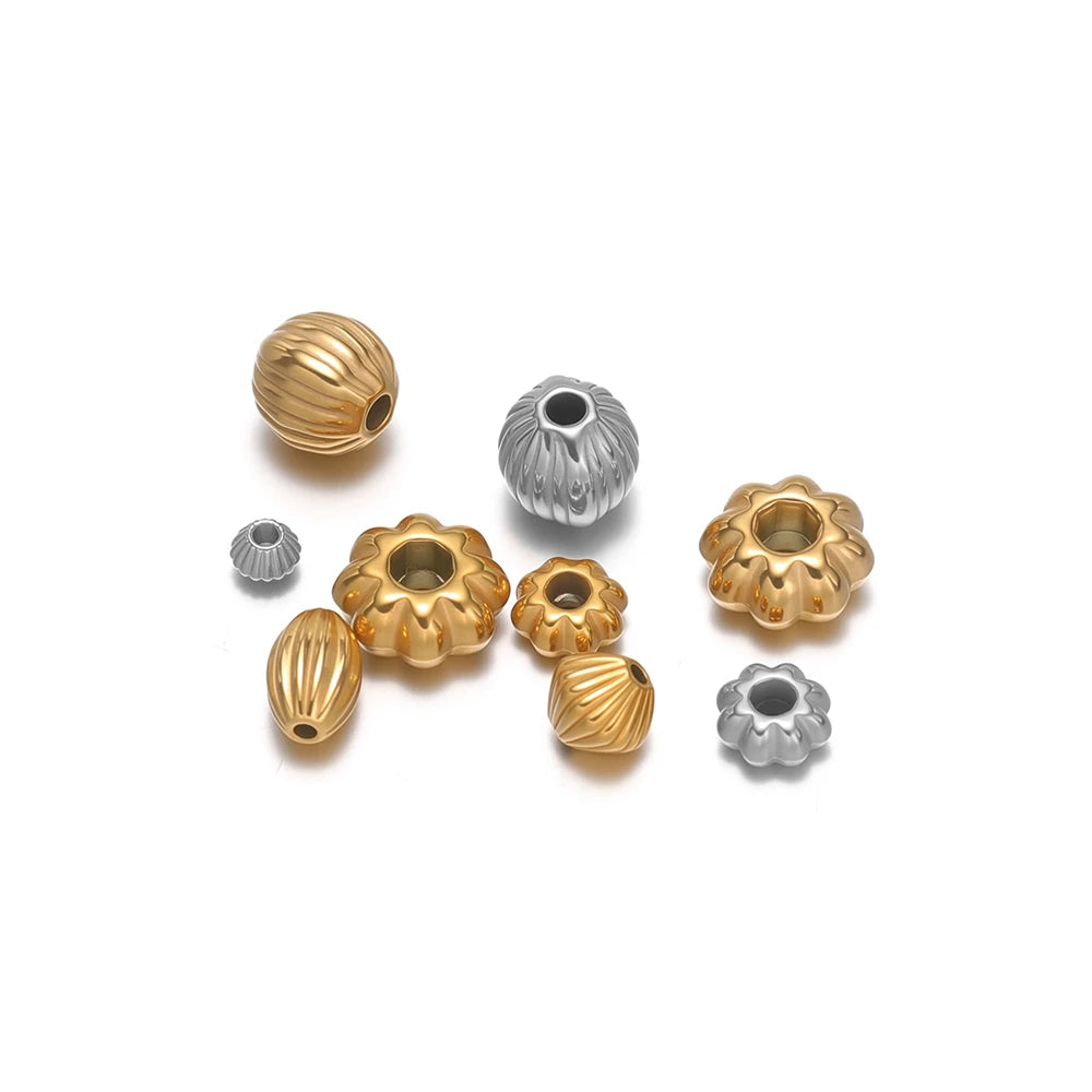 Pumpkin striped spacer beads in gold and silver with flower-shaped spacer charms