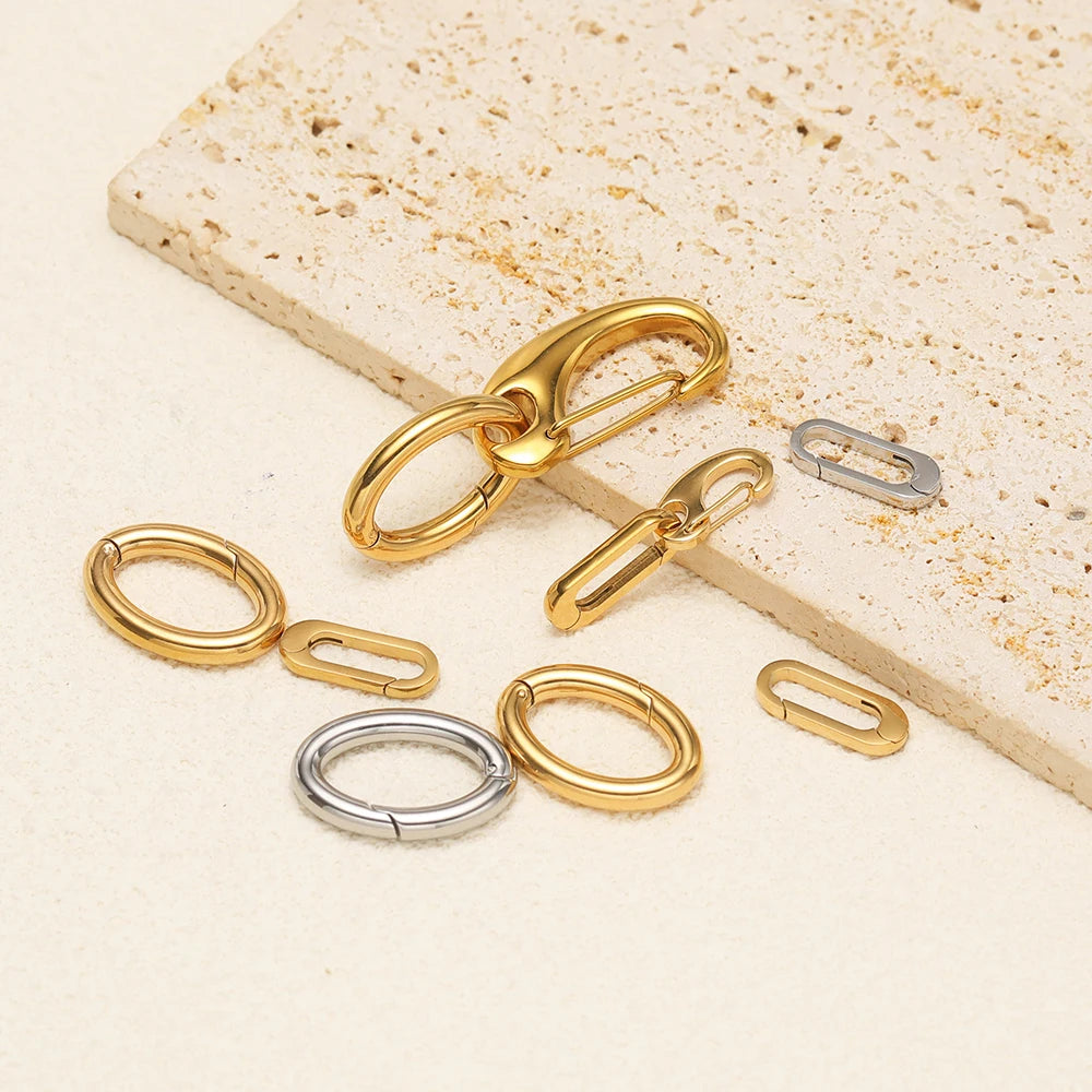 Gold and silver oval spring clasp hooks with hinged loops, mixed set