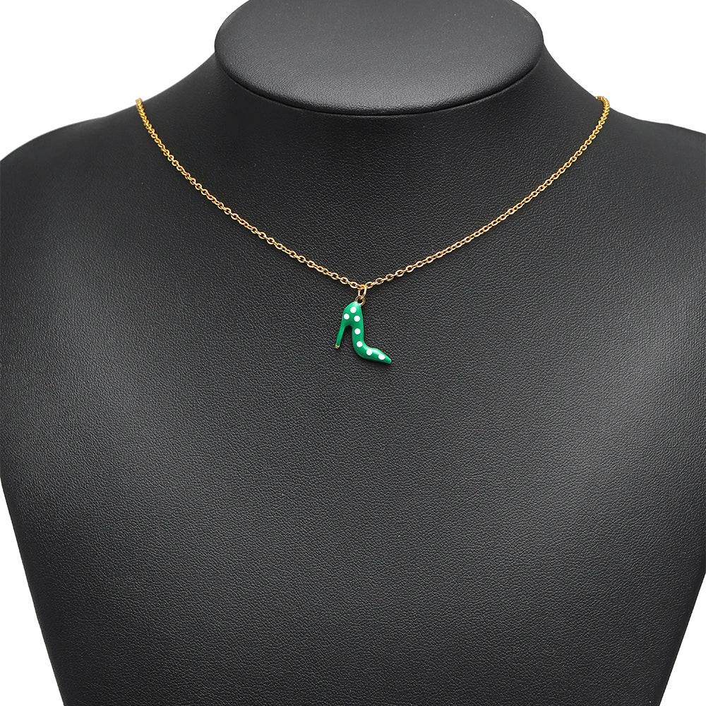 Gold-tone chain necklace with small green enamel high-heel pendant charm