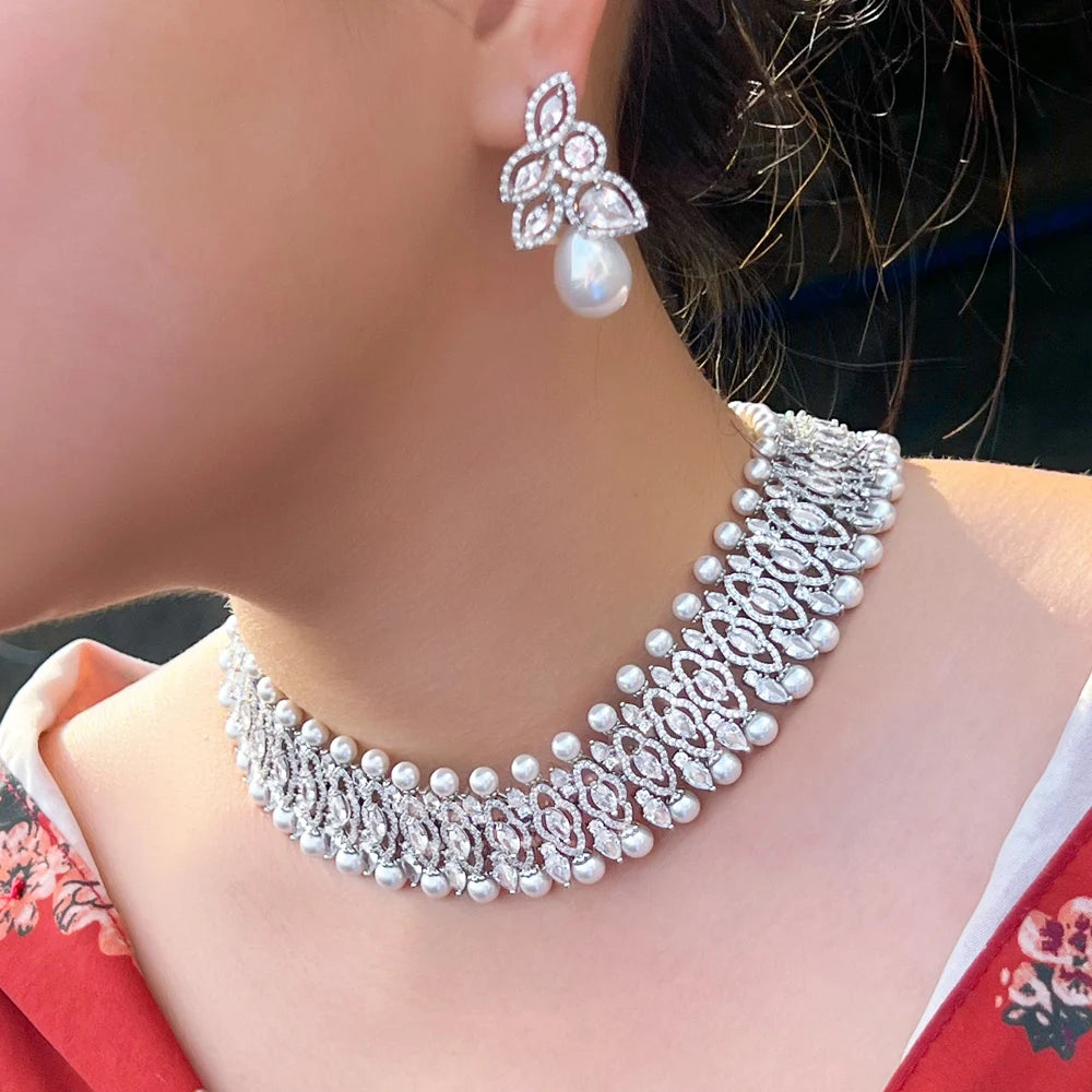 Silver-tone cubic zirconia choker with round pearl accents and pearl drop earrings