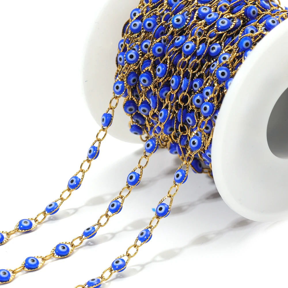 Evil eye bead chain with gold links and blue oval eye charms