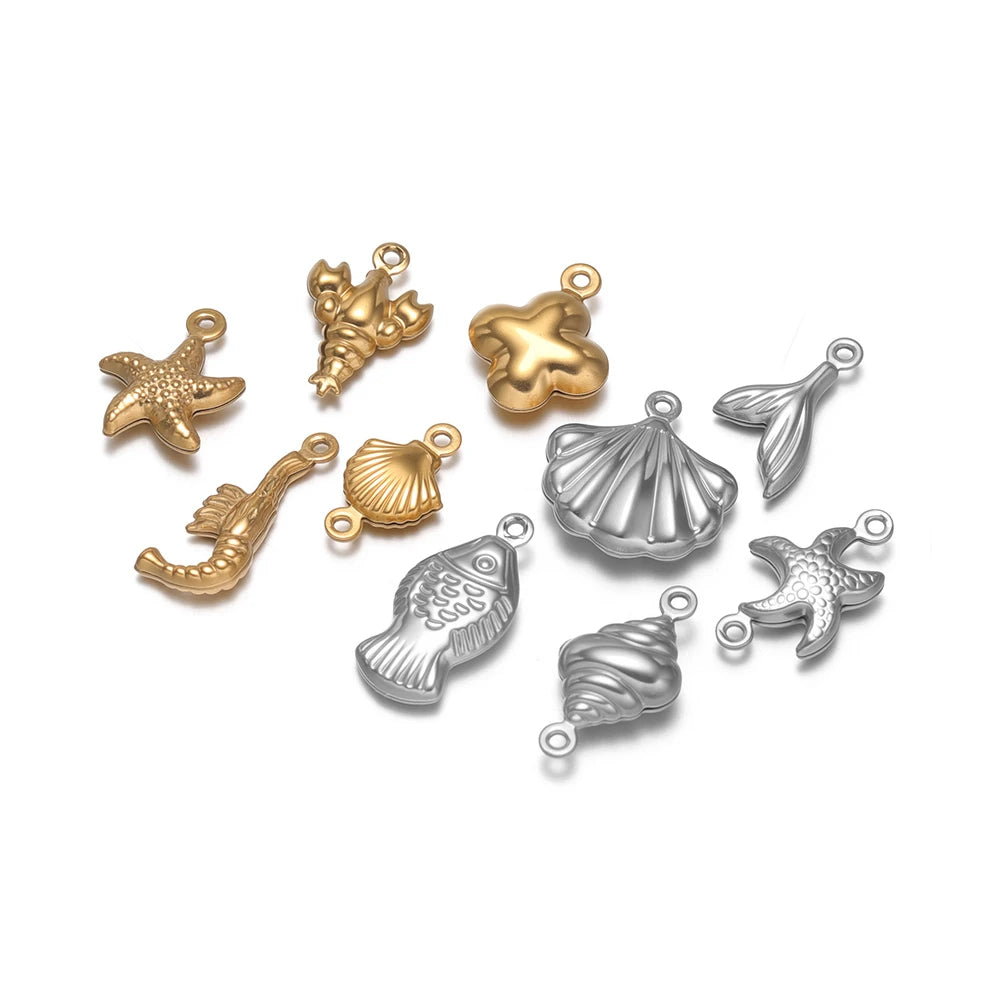 Gold and silver hollow sea-life pendant charms, starfish, shells, and fish, assorted