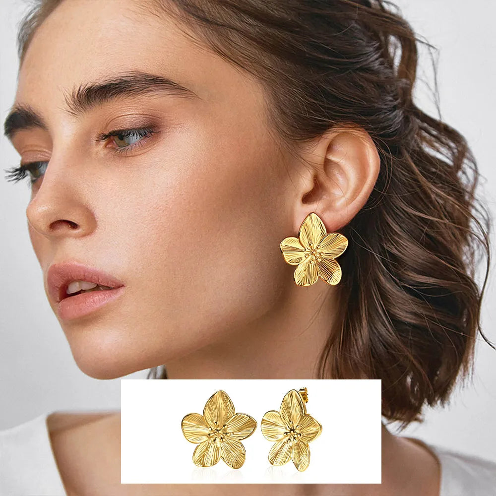 Gold-tone flower stud earrings with five textured petals.