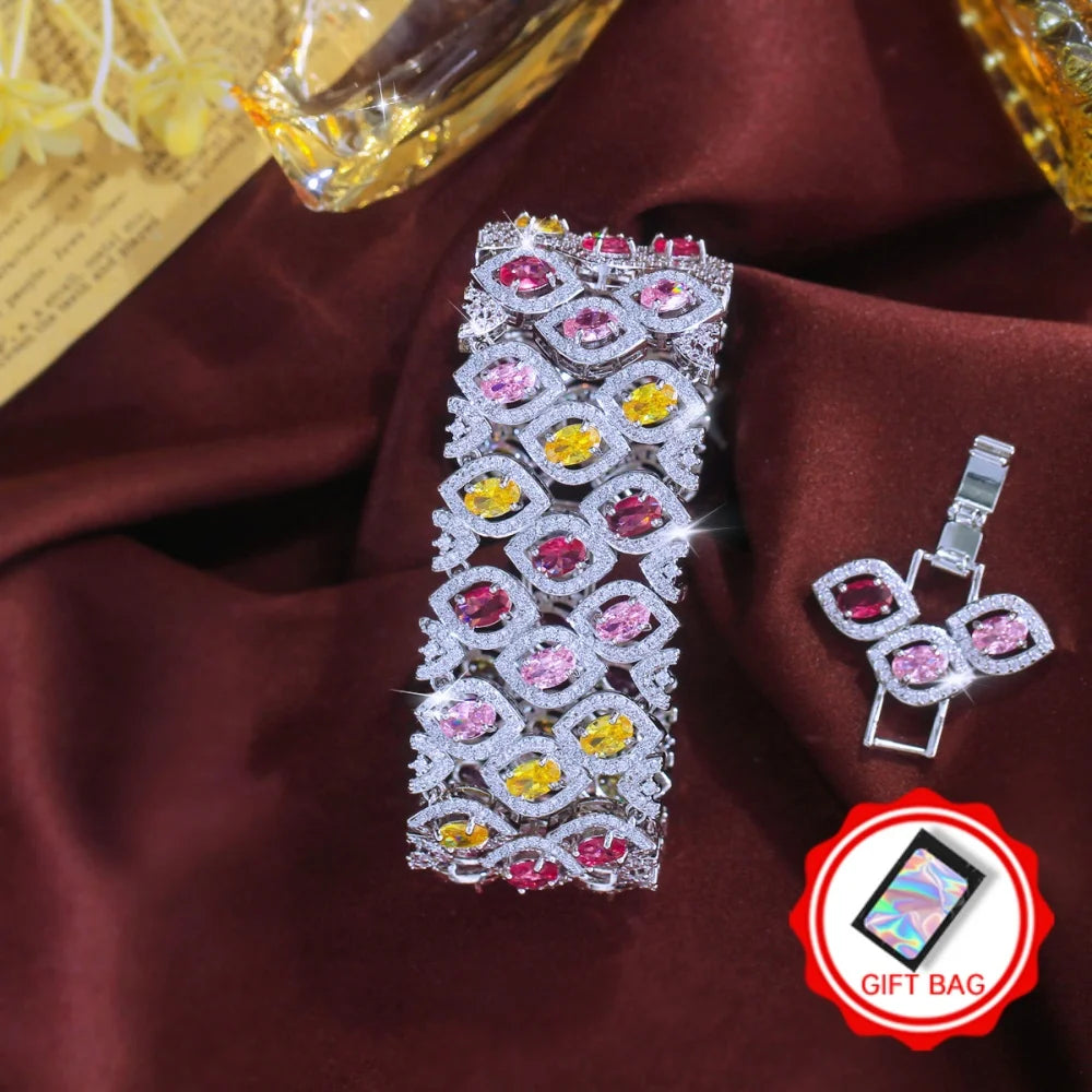 Wide silver-tone bracelet with pink, red, and yellow zirconia stones and matching clasp