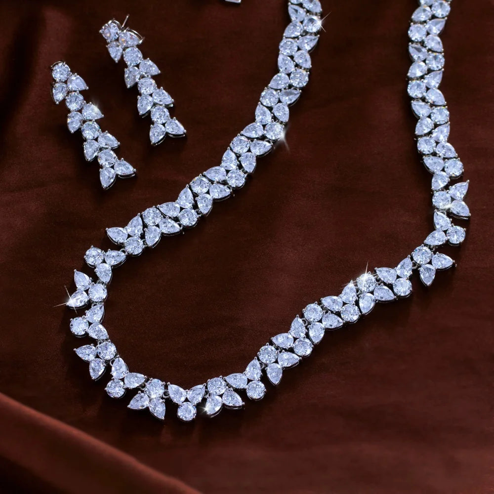 Close view of clear zirconia leaf necklace and matching drop earrings