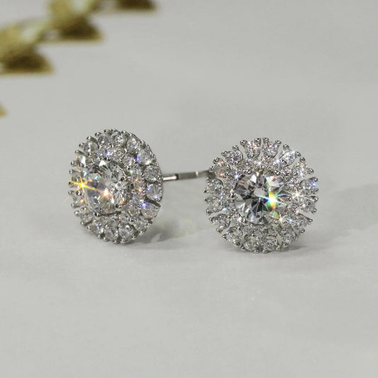 Silver cubic zirconia dainty stud earrings with round halo design