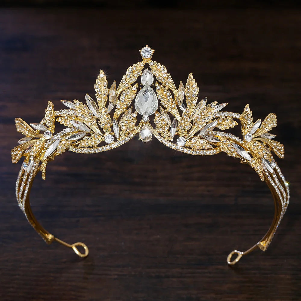 Gold rhinestone tiara headband with large clear center stone and sparkling leaf details