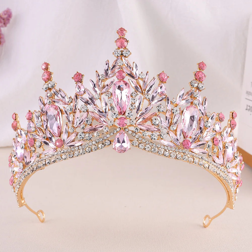 Crystal jeweled wedding tiara with pink stones, tall central crown and side drops