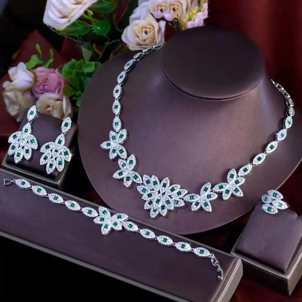 Green zirconia floral jewelry set display: necklace, drop earrings, tennis bracelet, ring