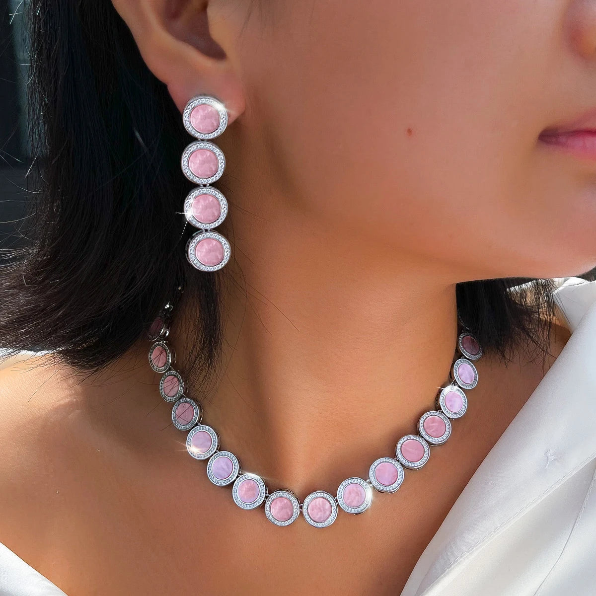 Pink oval link necklace and matching drop earrings with silver-tone settings