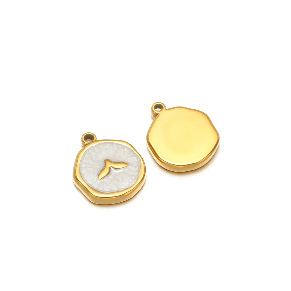 Pair of enamel ocean charms: yellow shell charm and light blue fish seashell charm