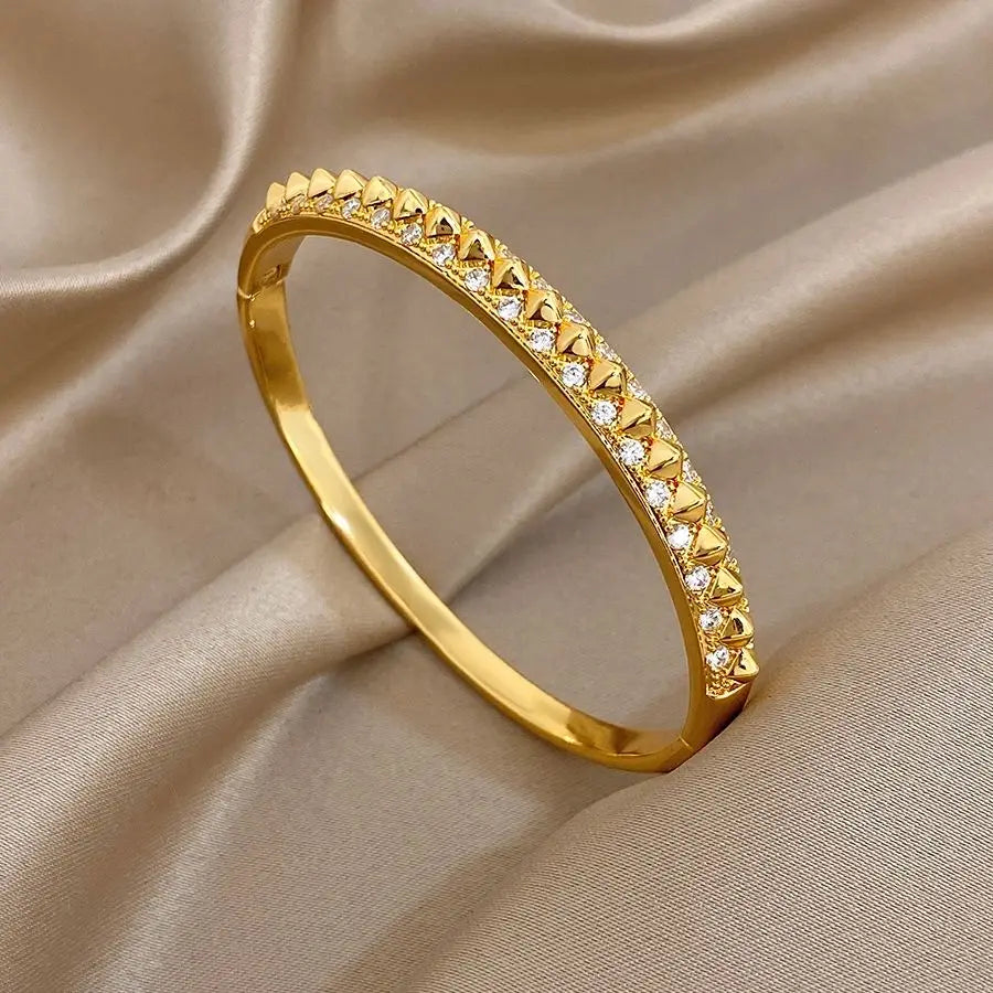 Gold-plated geometric zirconia rivet cuff bangle with triangular stone row