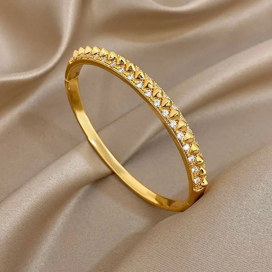 Gold-plated geometric zirconia rivet cuff bangle with triangular stone row