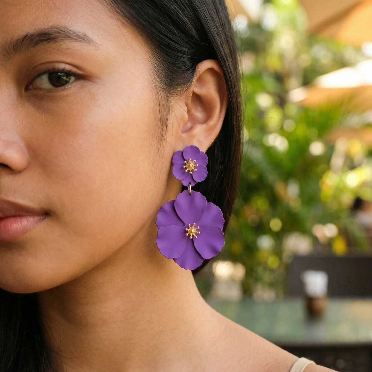 Purple double flower drop earrings with gold-tone accents