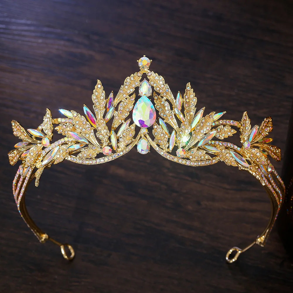 Gold rhinestone tiara headband with purple iridescent teardrop center and clear leaf stones
