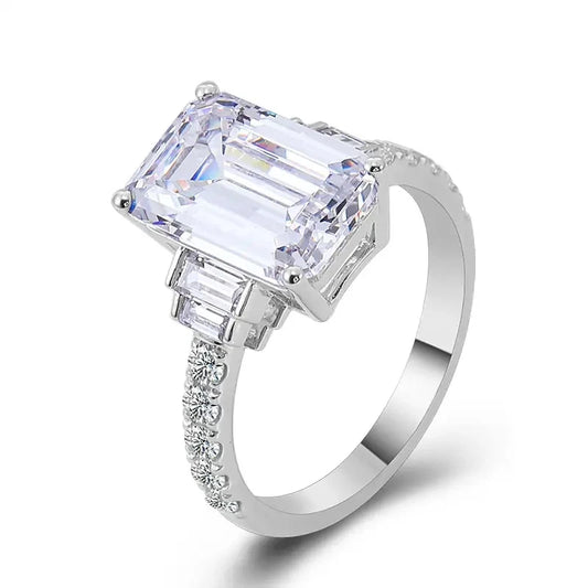 Silver-toned rectangular zirconia proposal ring with side baguette stones