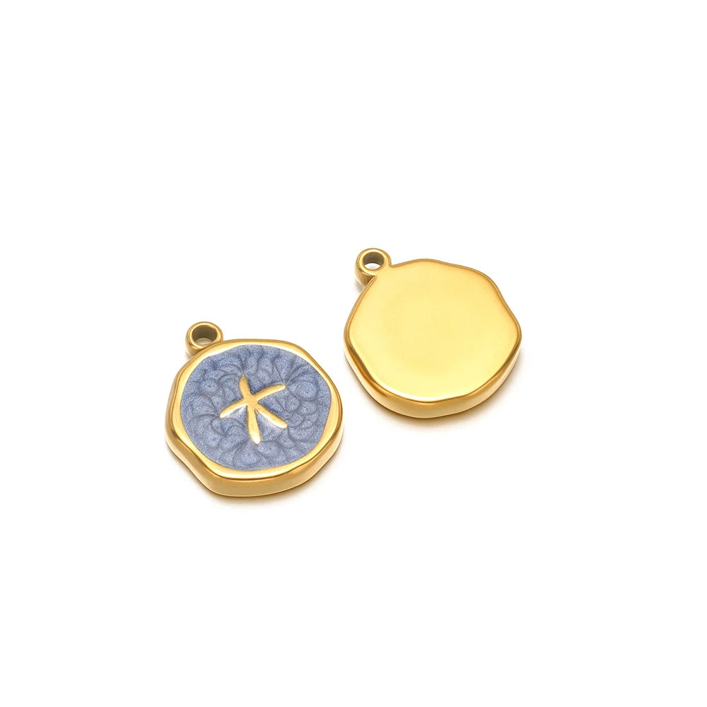 Pair of enamel ocean charms: yellow shell charm and blue starfish charm