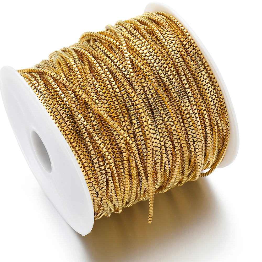 Gold box chain in stainless steel, 2mm width, on a white spool for DIY jewelry making