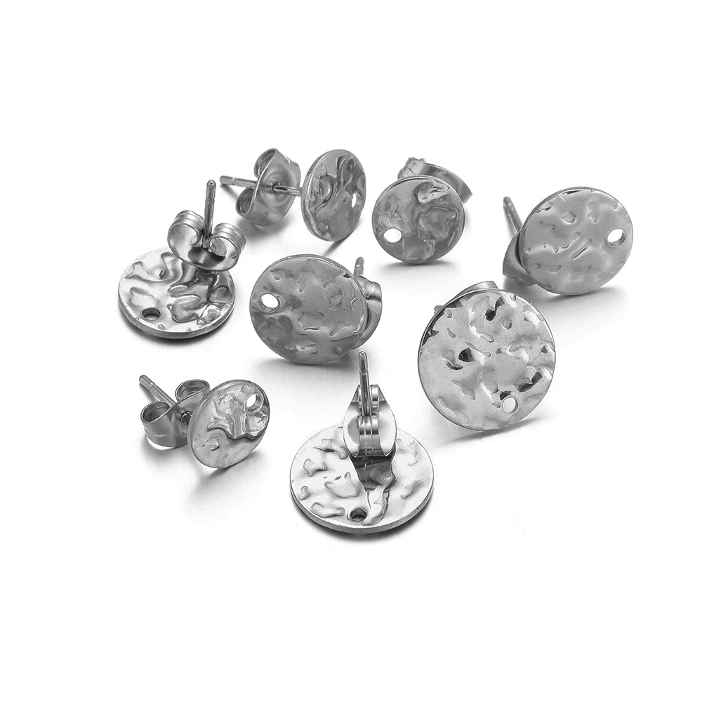 Silver-tone round embossed stud earrings, ripple-textured discs with metal post backs, set
