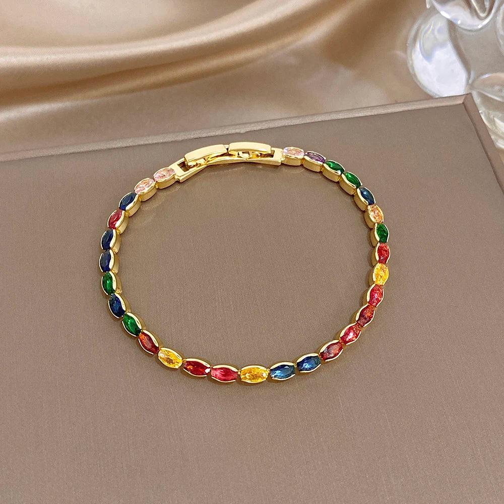 Gold-plated link bracelet with rainbow oval zircon stones and secure clasp