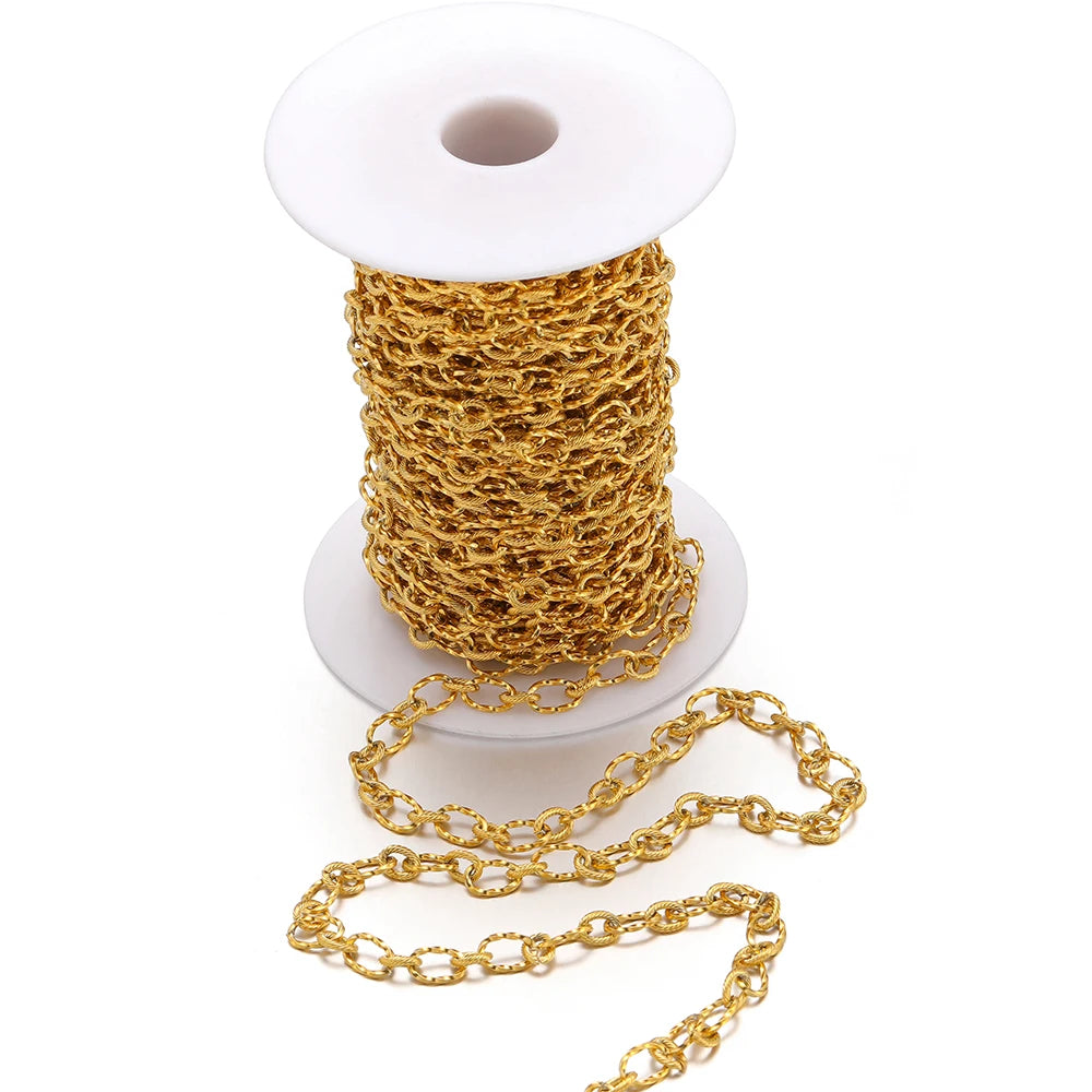 Gold stainless steel rolo cable chain on a spool, oval links, bulk jewelry chain