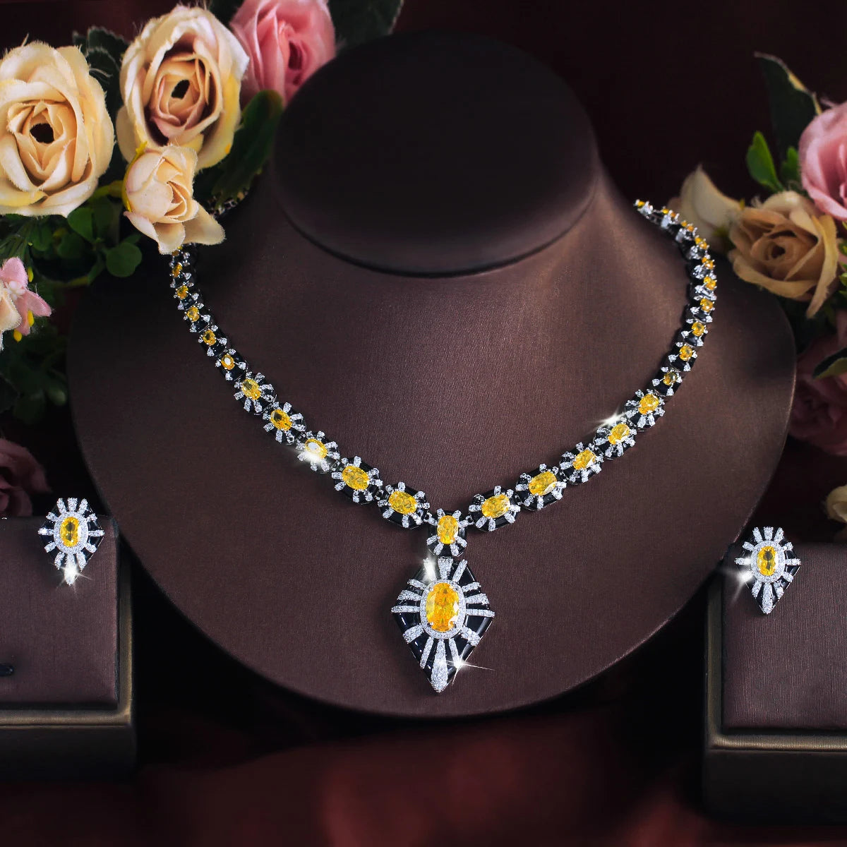 Necklace with a large yellow zircon pendant and matching black enamel earrings.