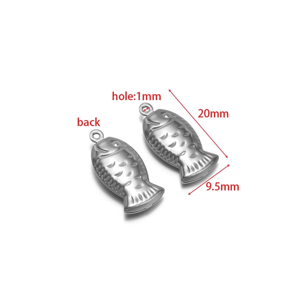Silver fish-shaped stainless steel hollow charm with round loop, for jewelry making