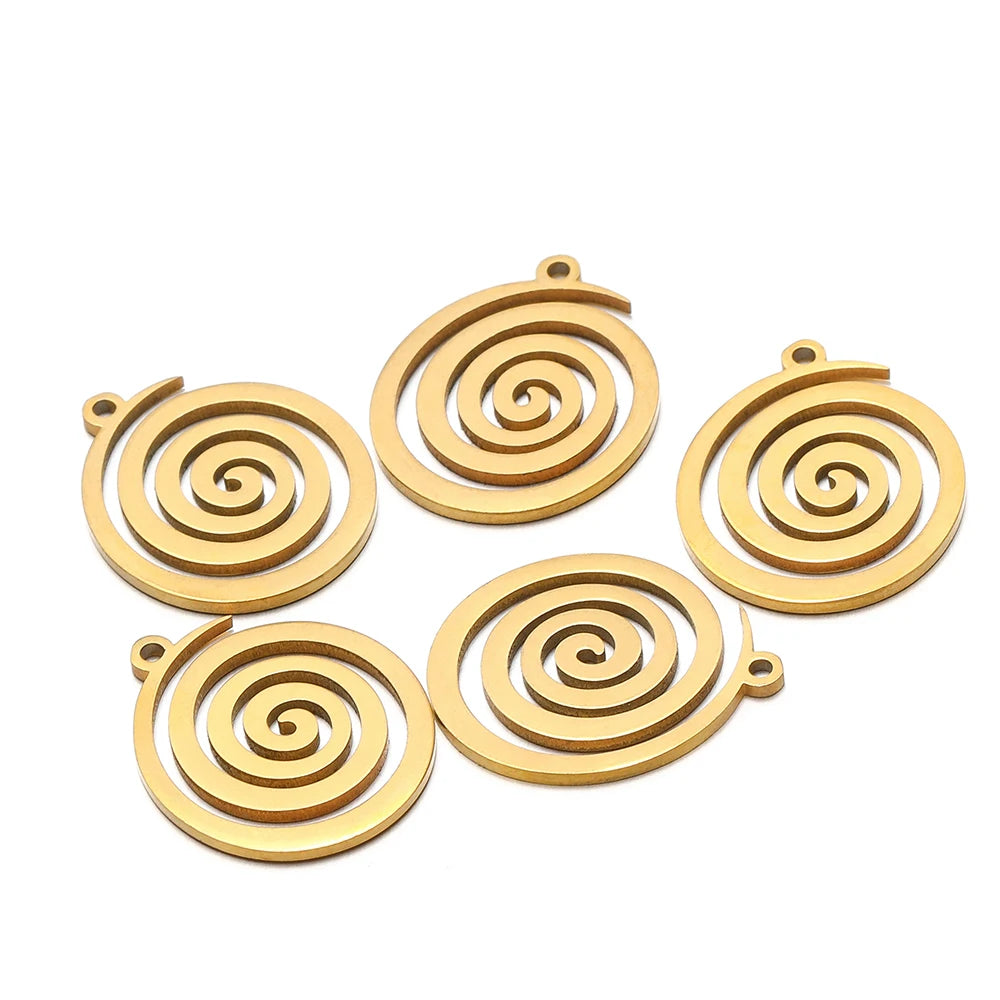 Gold spiral round charm pendants with loop bail, swirl pattern, flat lay of five