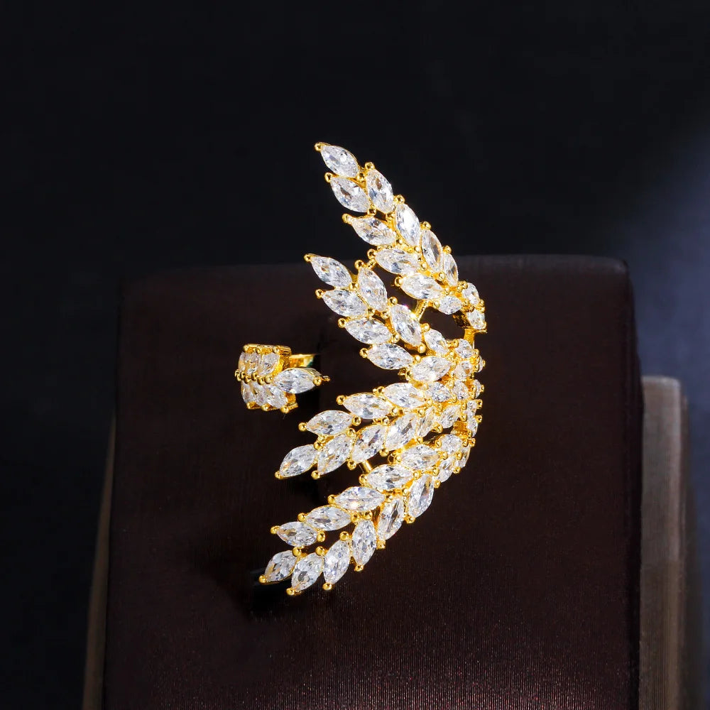 Gold-tone open ring with sweeping rows of clear marquise-cut stones