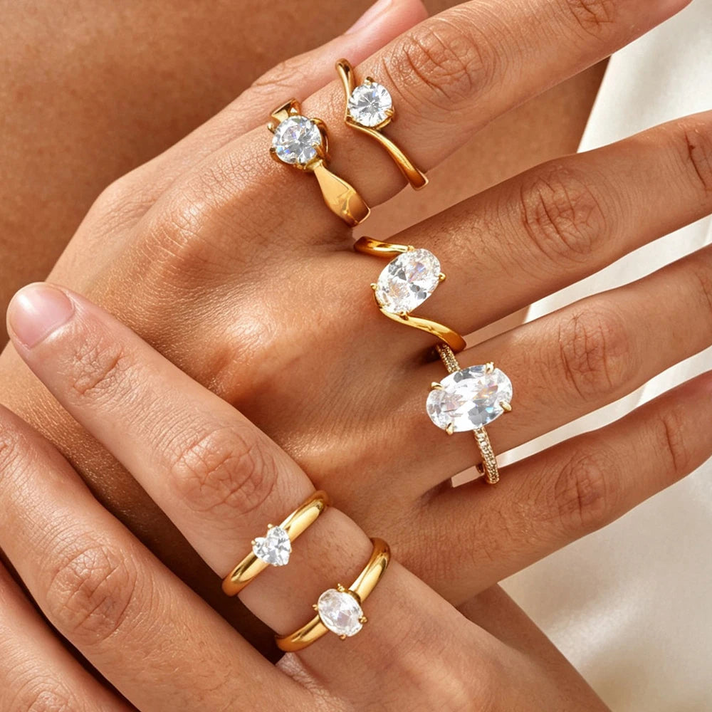 Gold-tone solitaire ring with round cubic zirconia, open band design