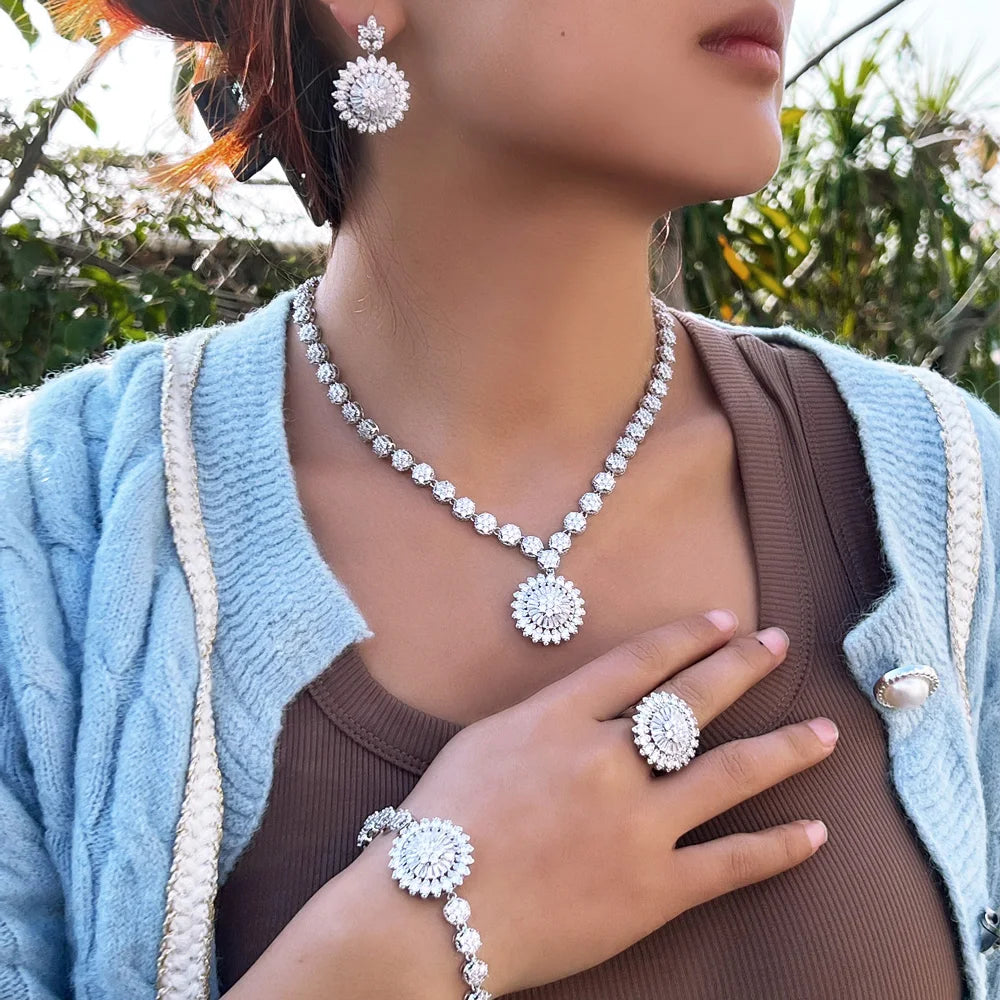Silver-tone sunflower zirconia jewelry set with necklace, ring, stud earrings, bracelet.