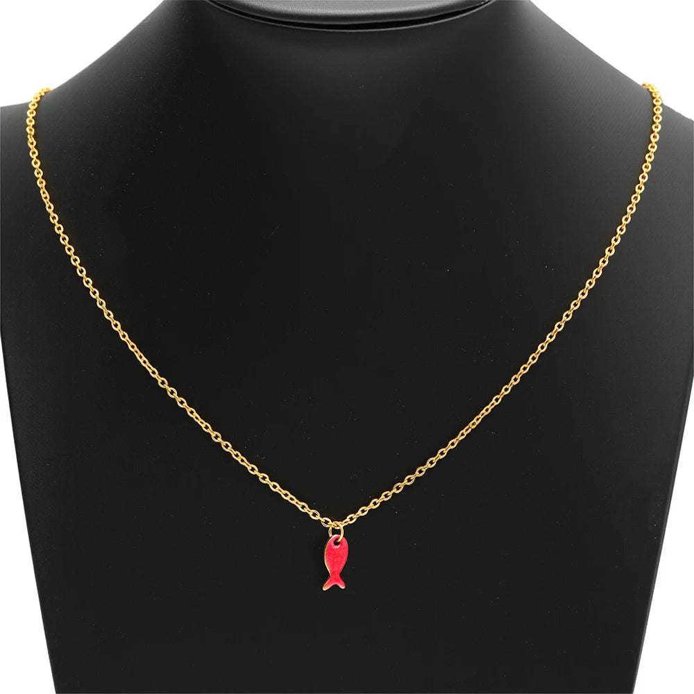Gold chain necklace with small red fish charm pendant