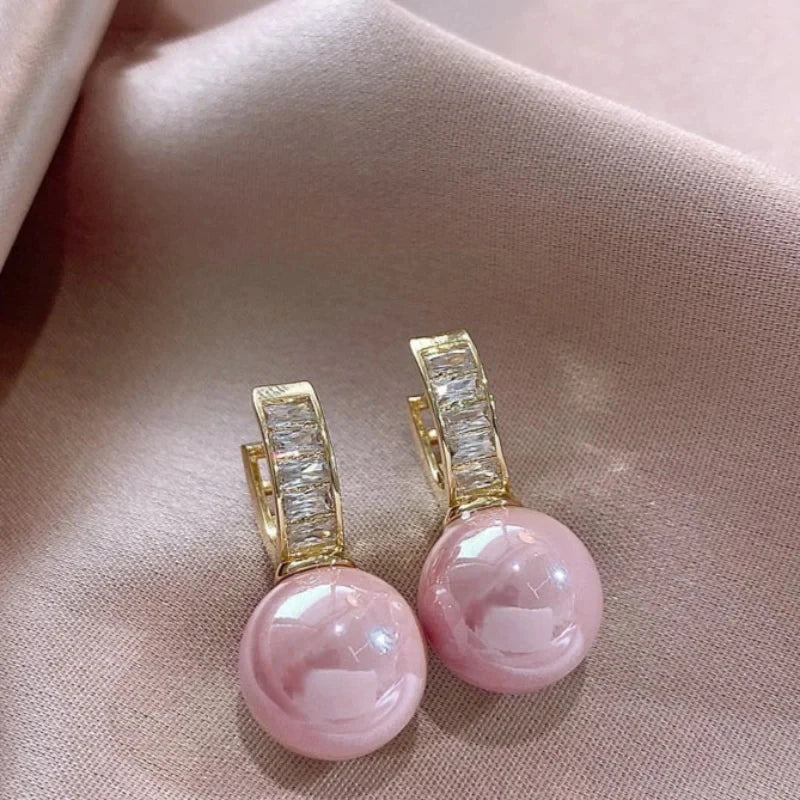 Gold-tone hoop earrings with round light pink imitation pearl drops