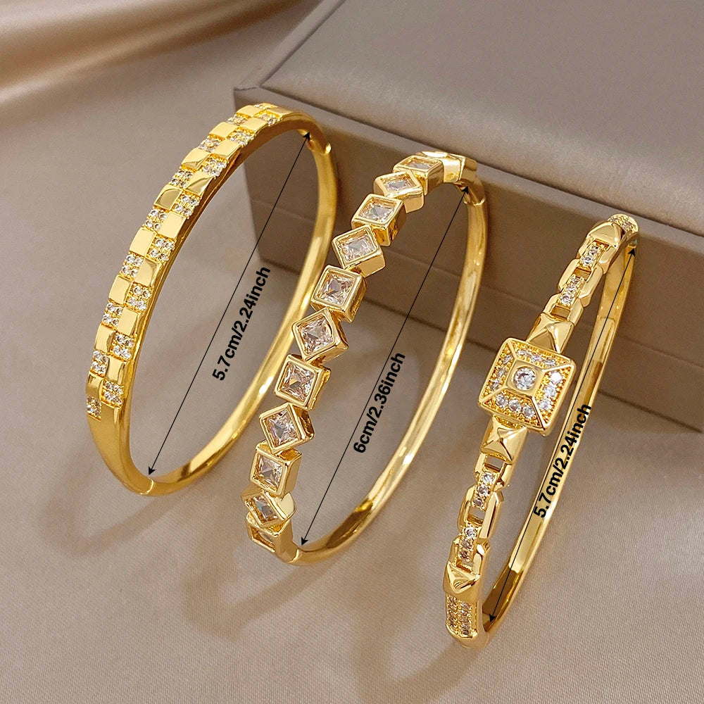 Gold-plated cuff bangles with square zirconia centers and engraved size marks