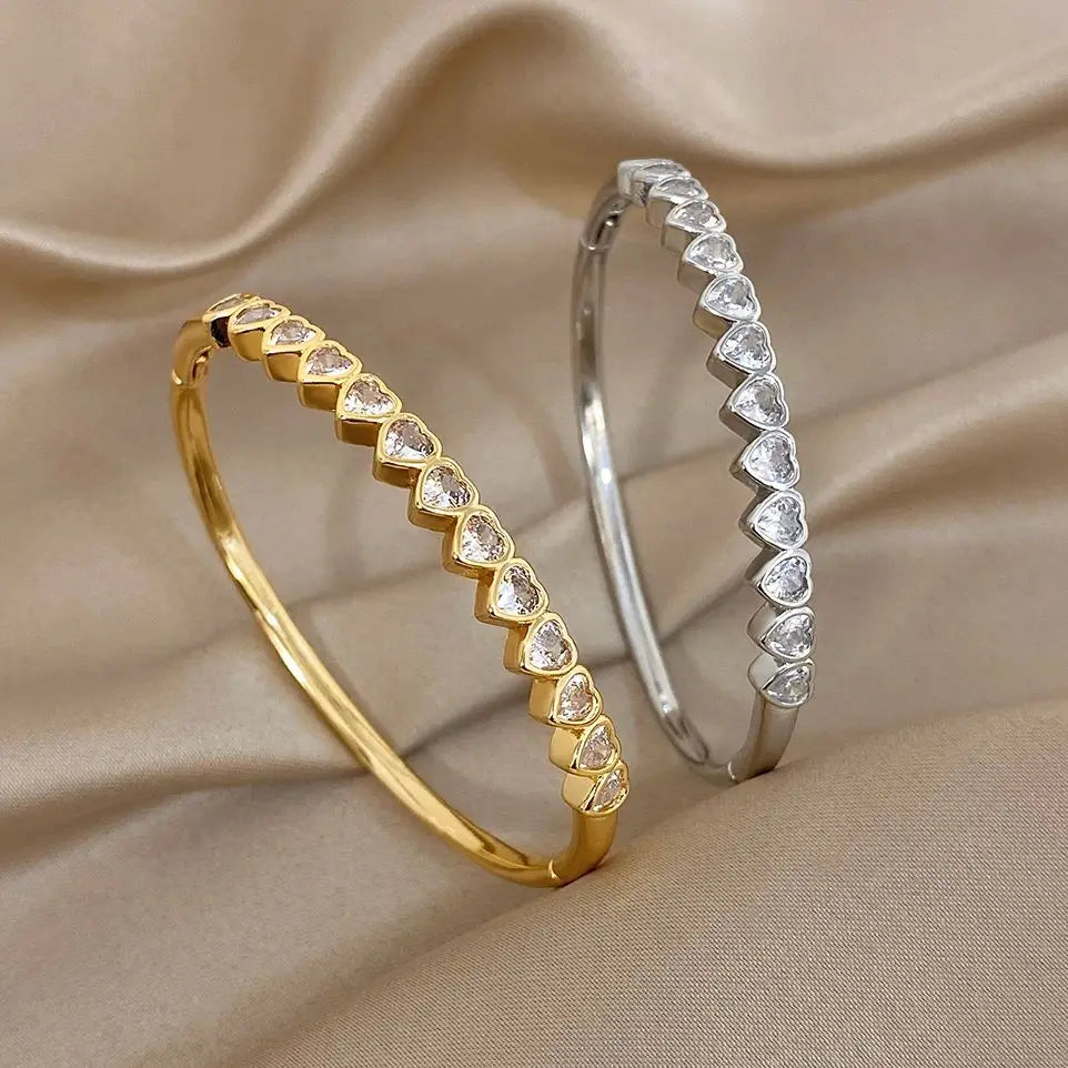 Gold-tone heart crystal inlay cuff bracelet with hinged oval bangle